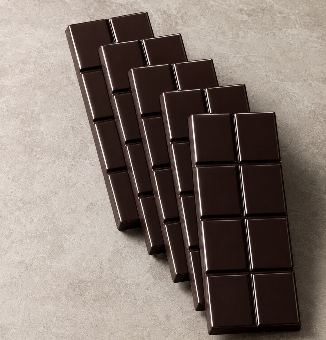 Five unwrapped HaskaNoir bars showing the divided squares